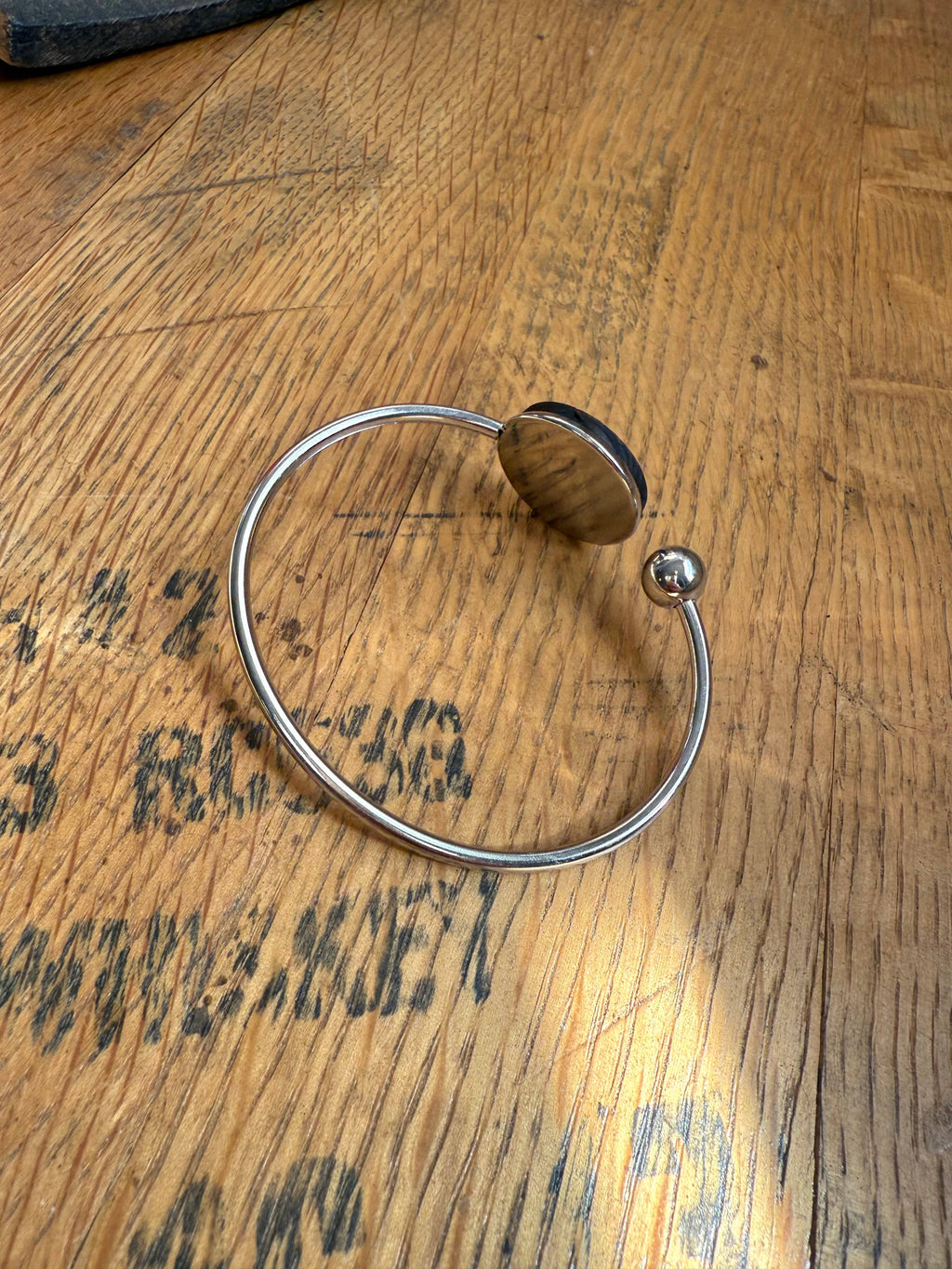 Kentucky State Bracelet made from bourbon whiskey barrels.
