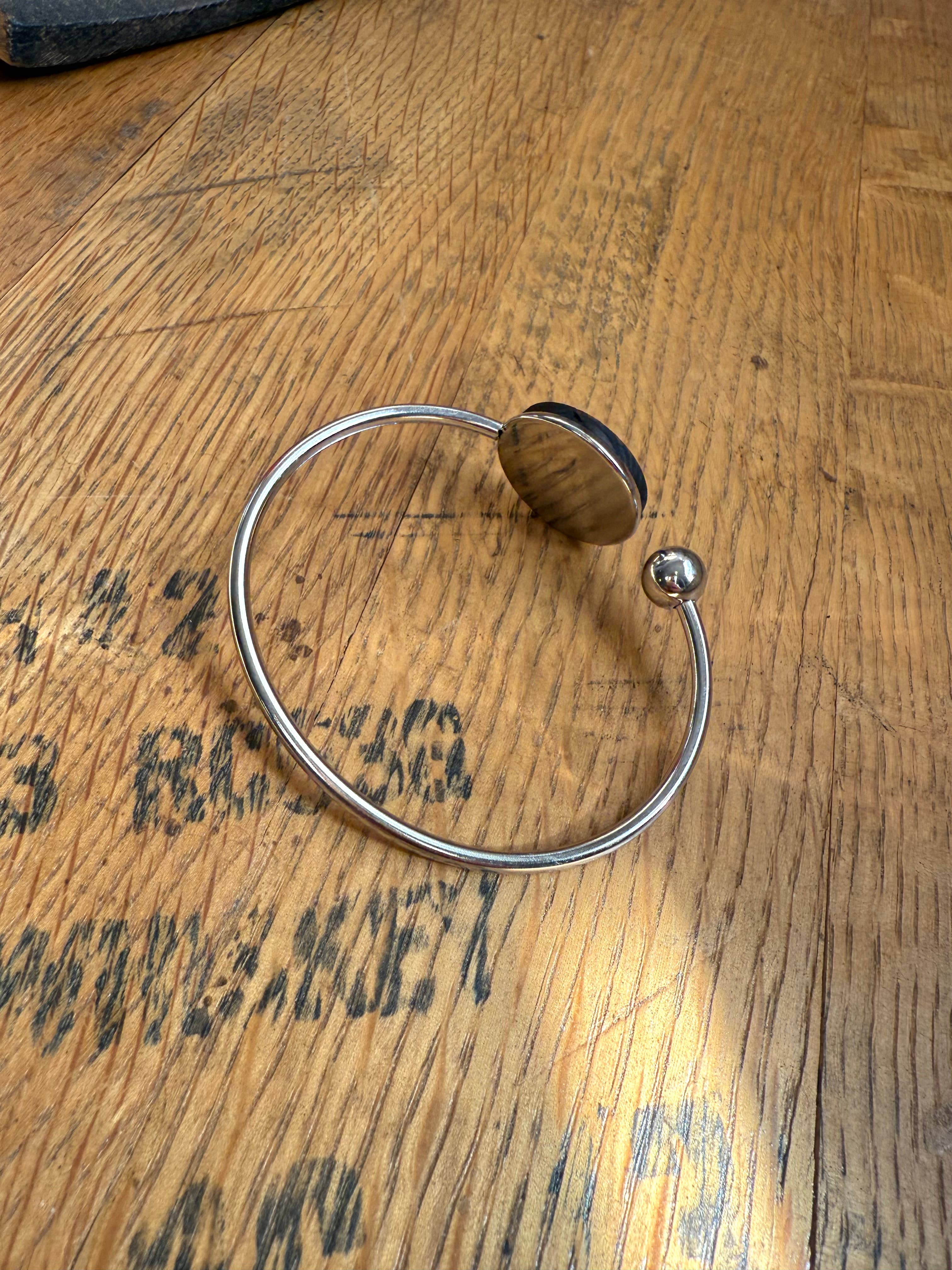 Kentucky State Bracelet made from bourbon whiskey barrels.