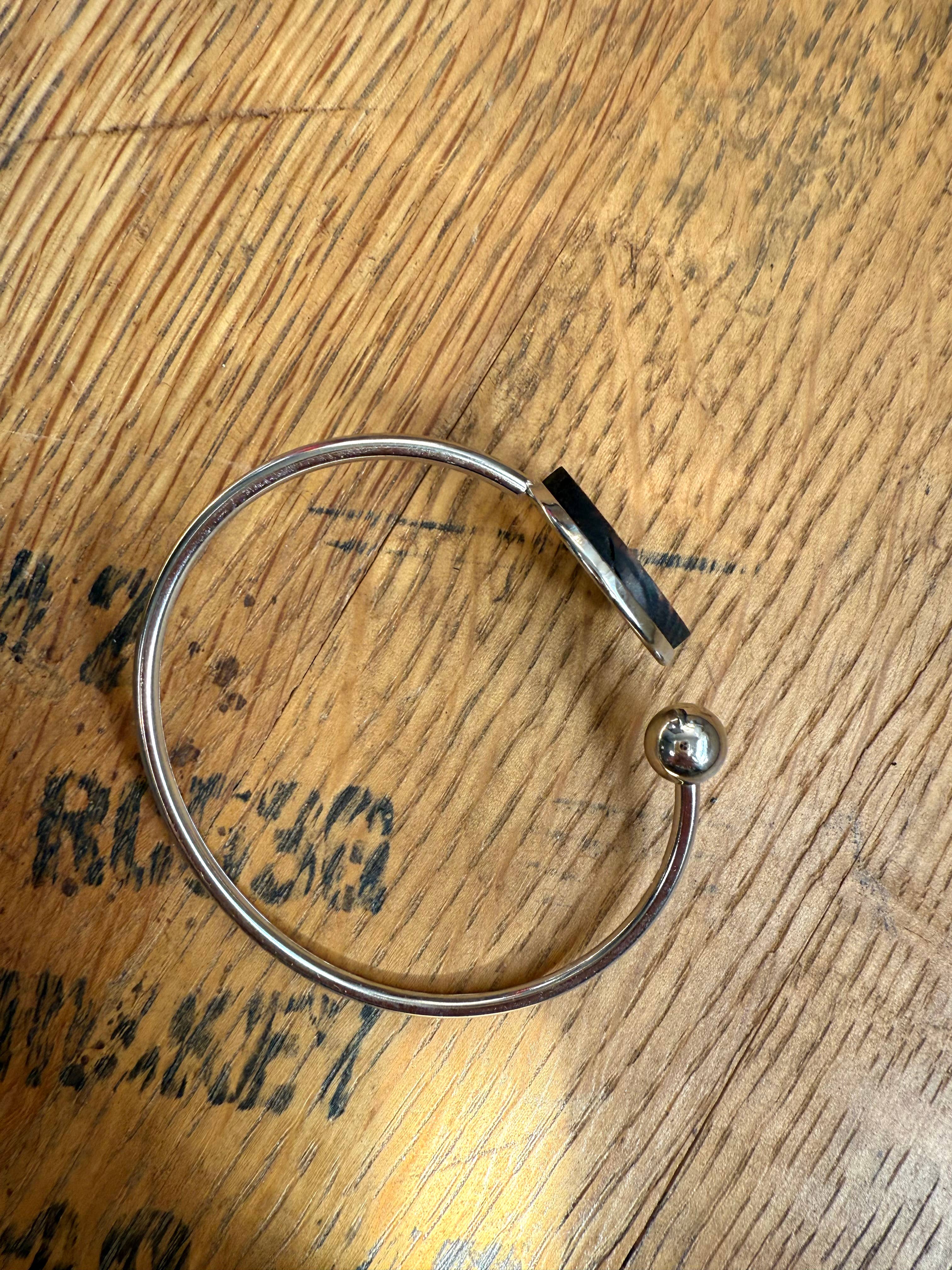 Kentucky State Bracelet made from bourbon whiskey barrels.