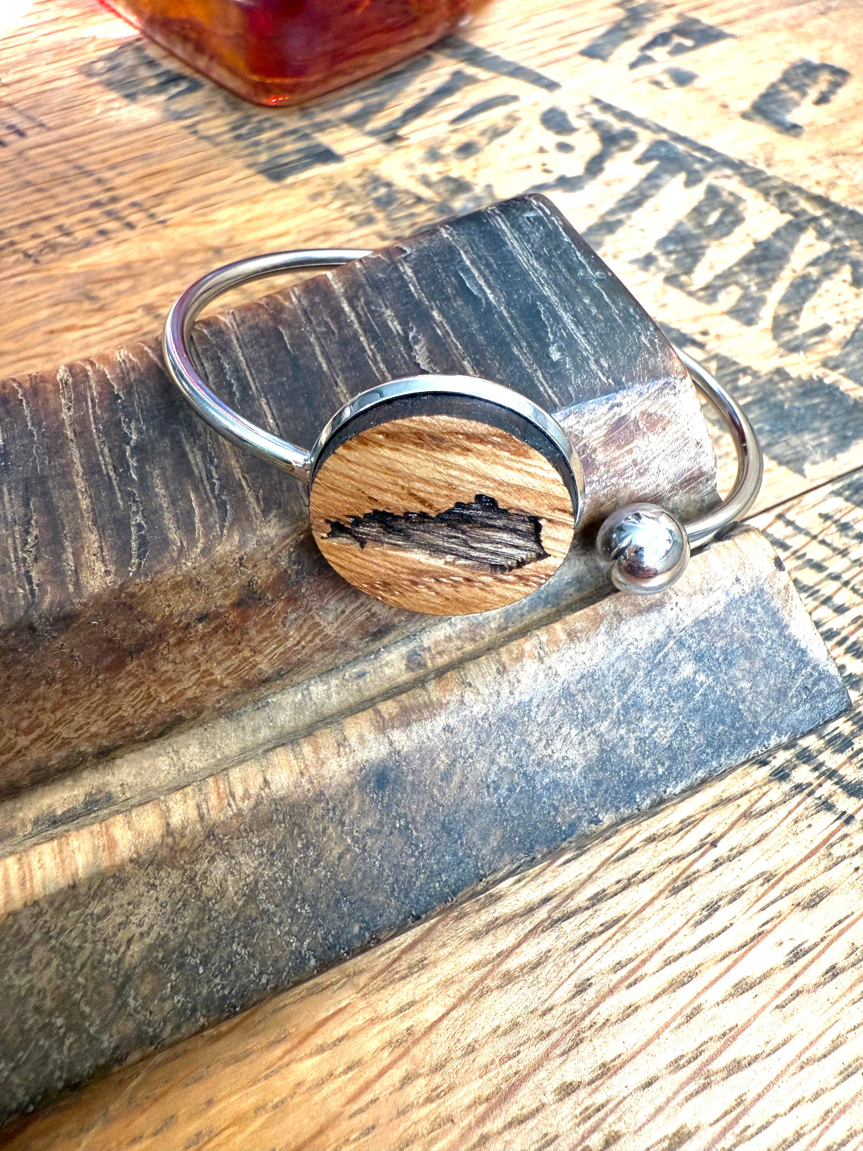 Kentucky State Bracelet made from bourbon whiskey barrels.